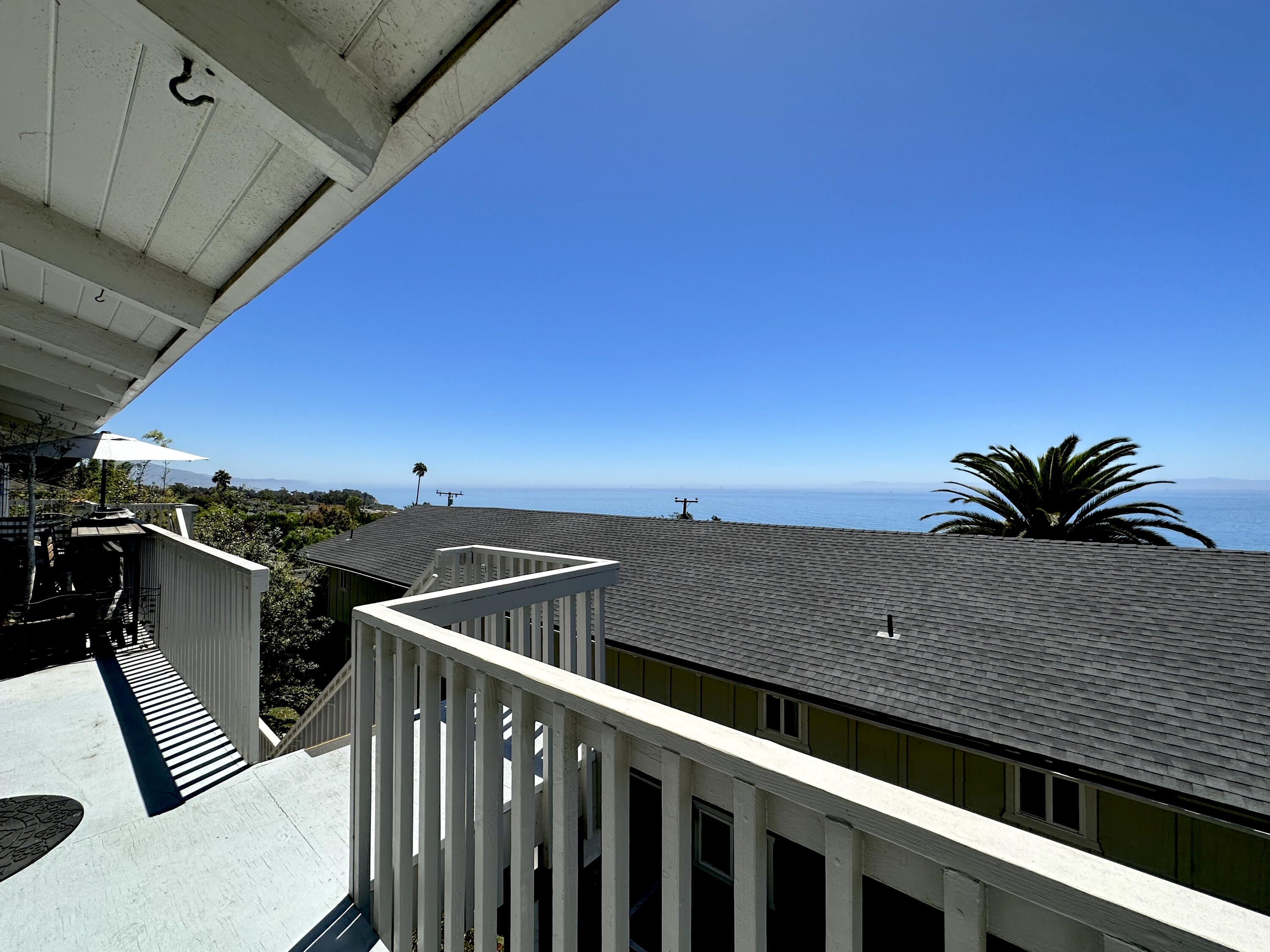 a view of balcony with furniture