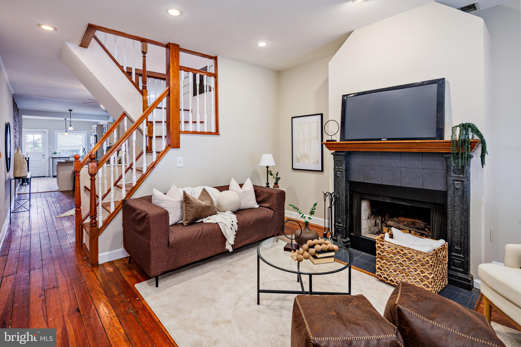 a living room with furniture and a fireplace