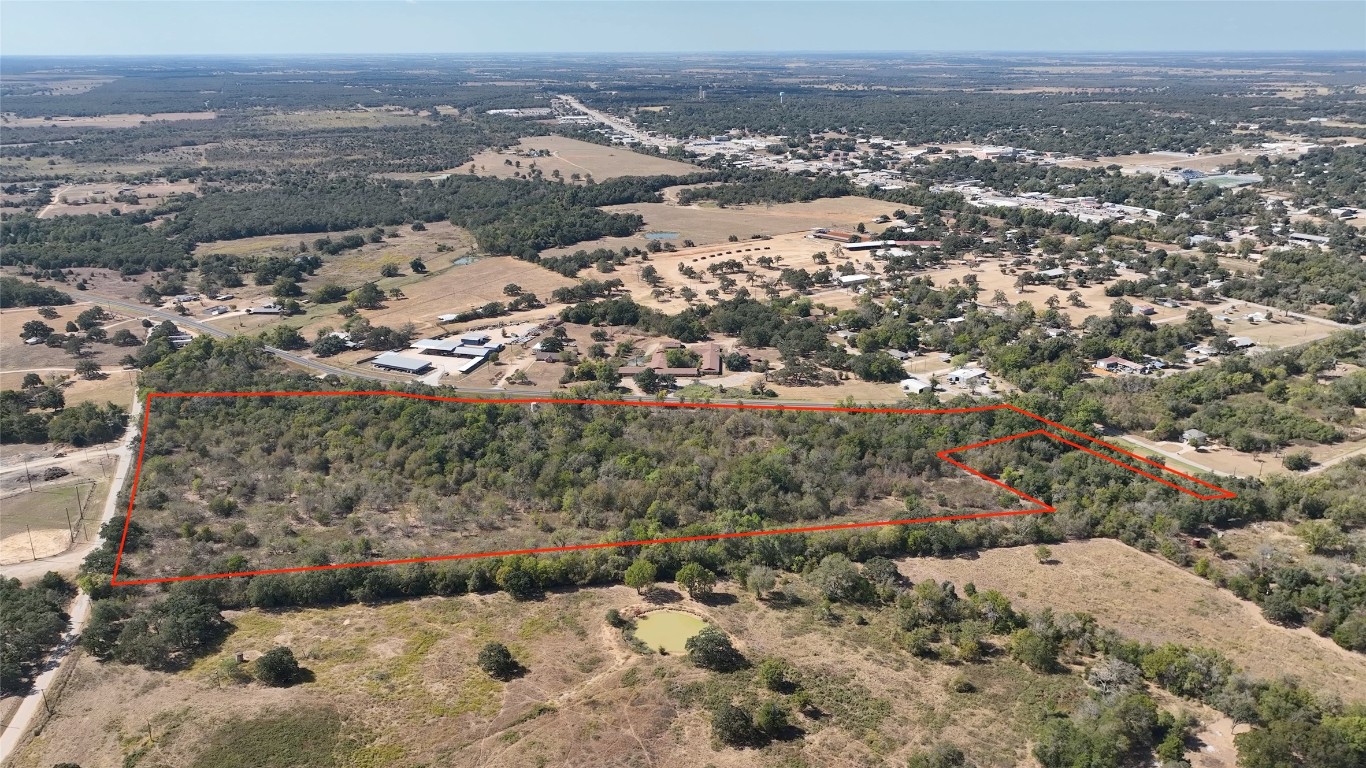 an aerial view of house with yard