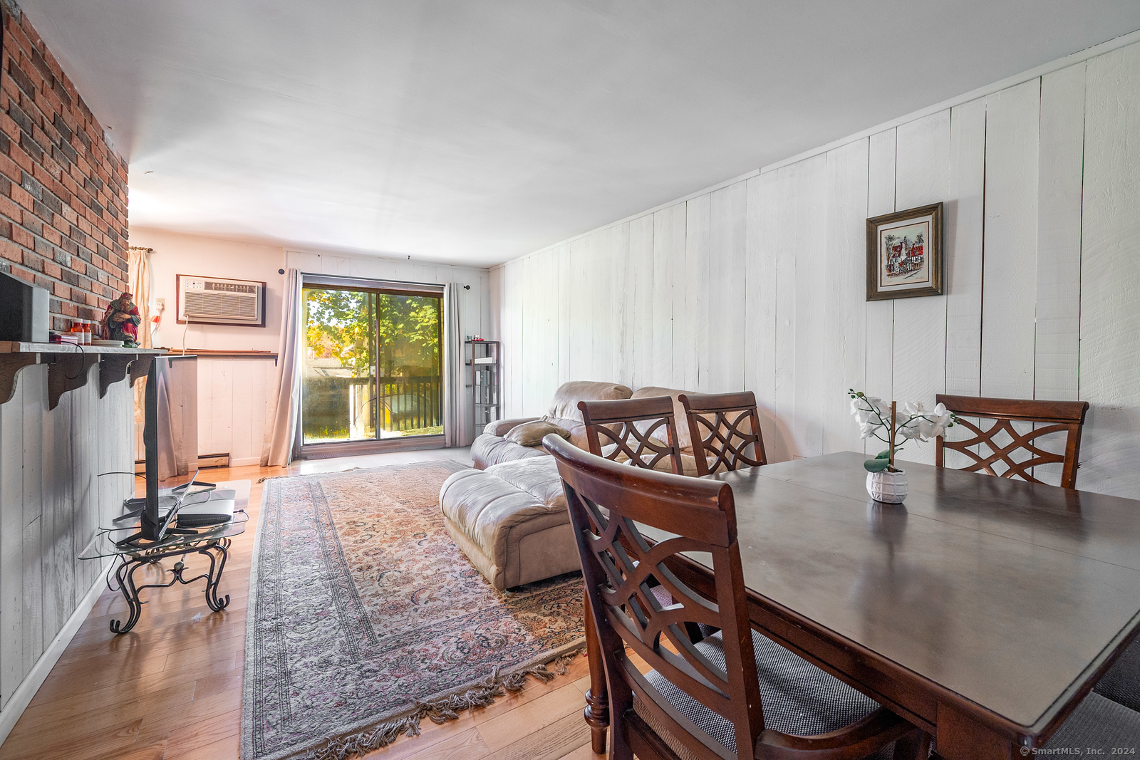 a view of a livingroom with furniture and a table