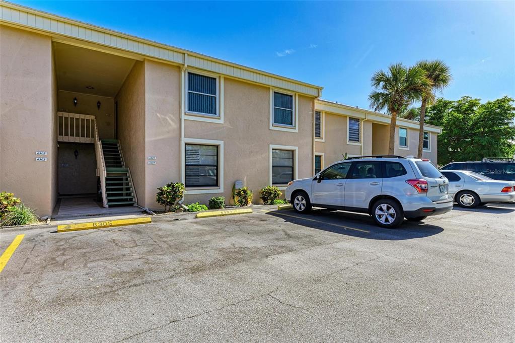 a view of a car parked in front of a house