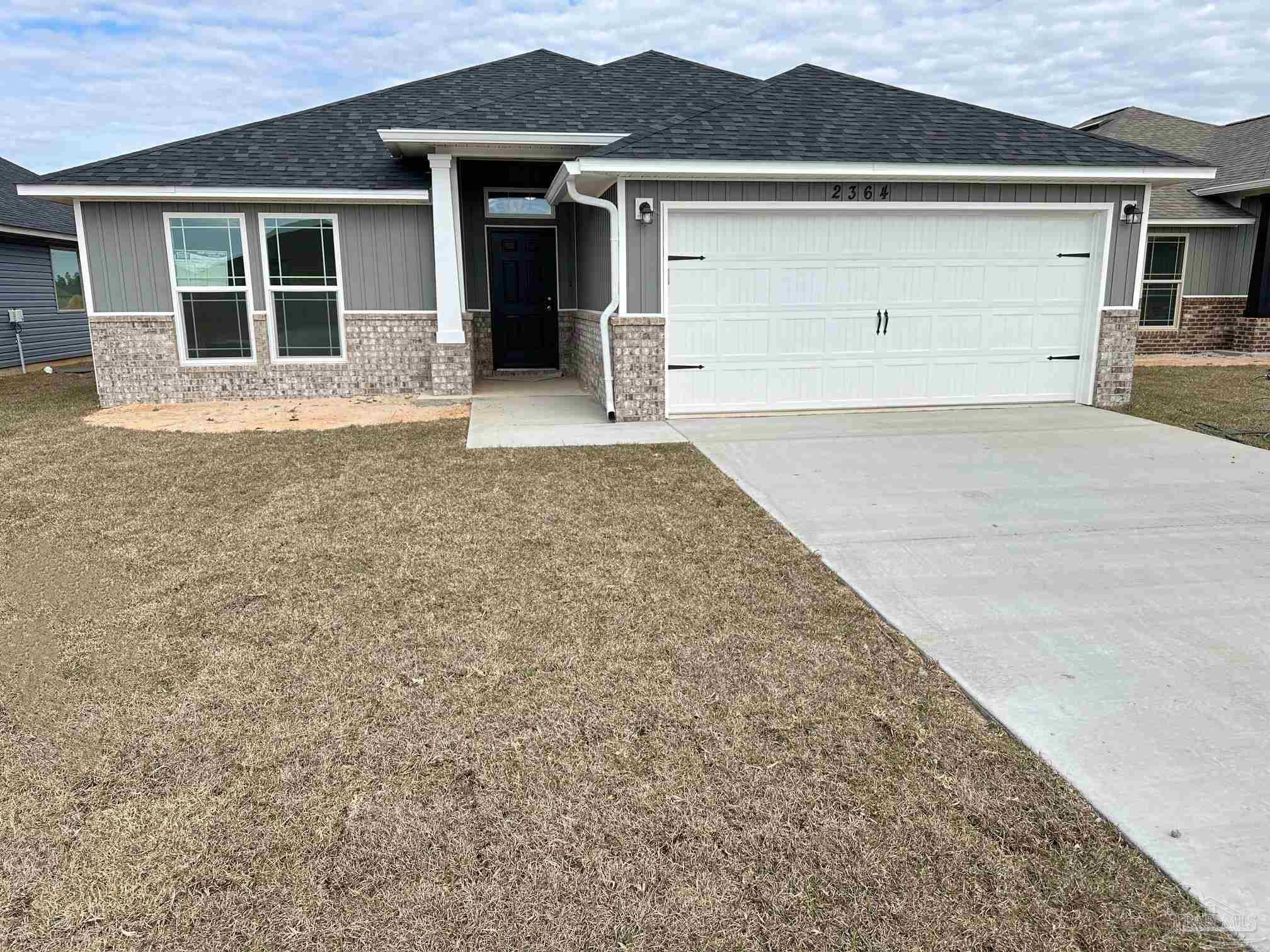 front view of a house with a yard