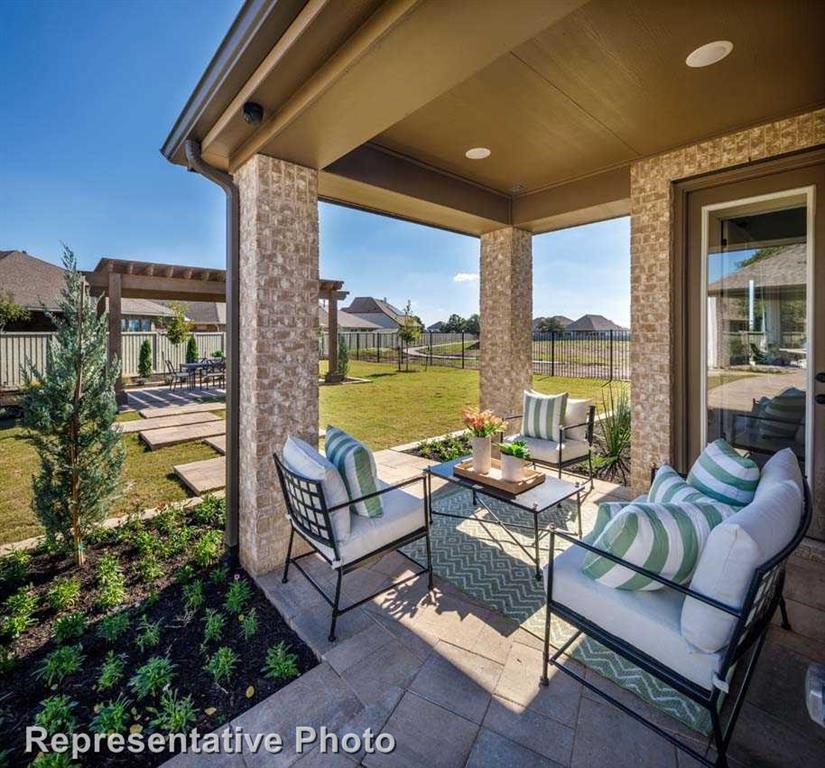 a outdoor living space with furniture and a potted plant