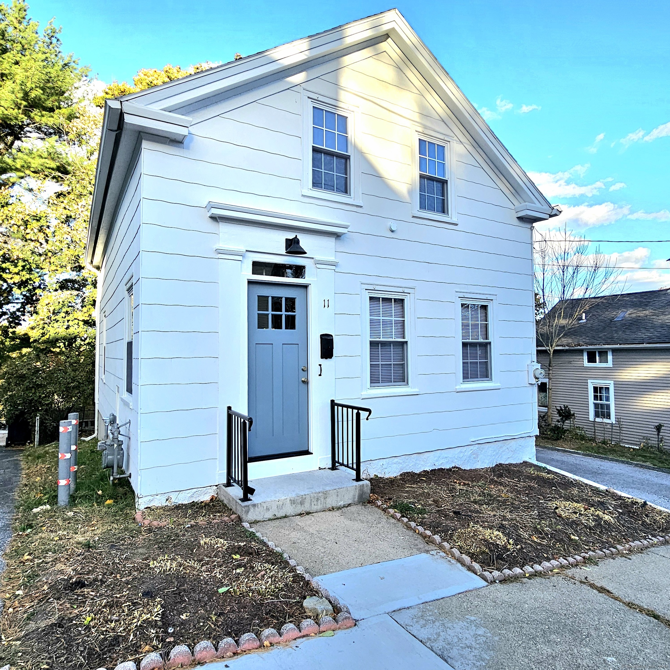 a front view of a house with a yard