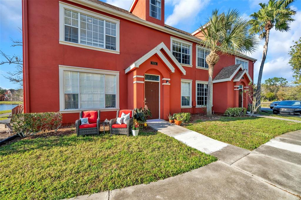 a front view of house with yard and green space