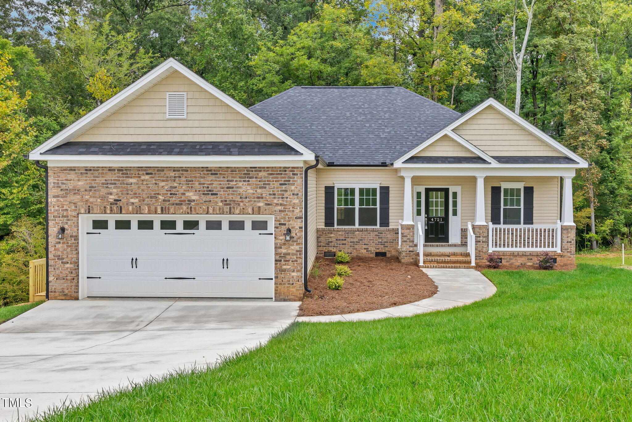 a view of a house with a yard and sitting area