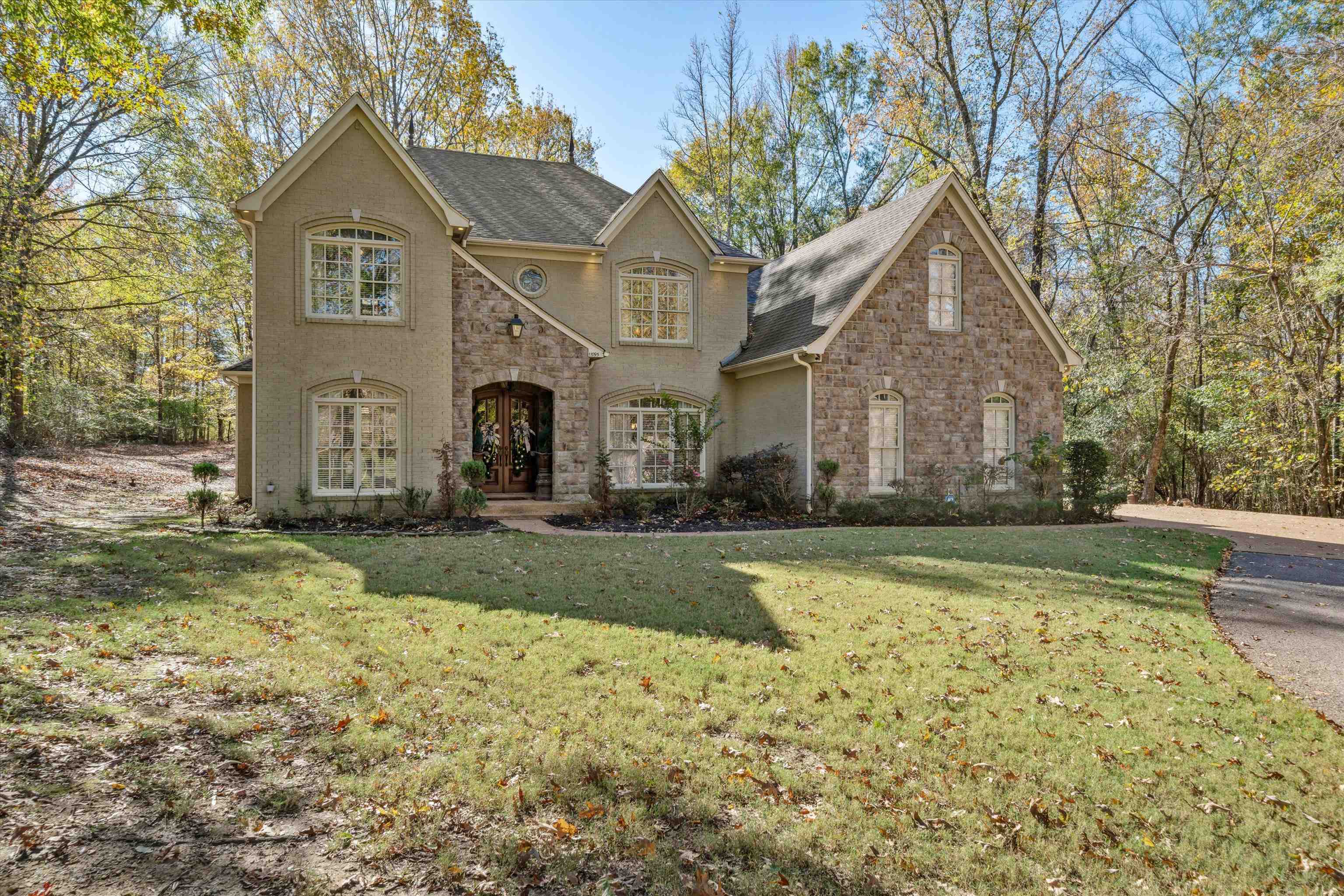 a front view of a house with a yard