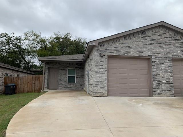 front view of a house with a garage