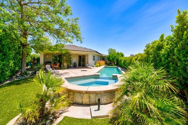 a view of a swimming pool with a garden