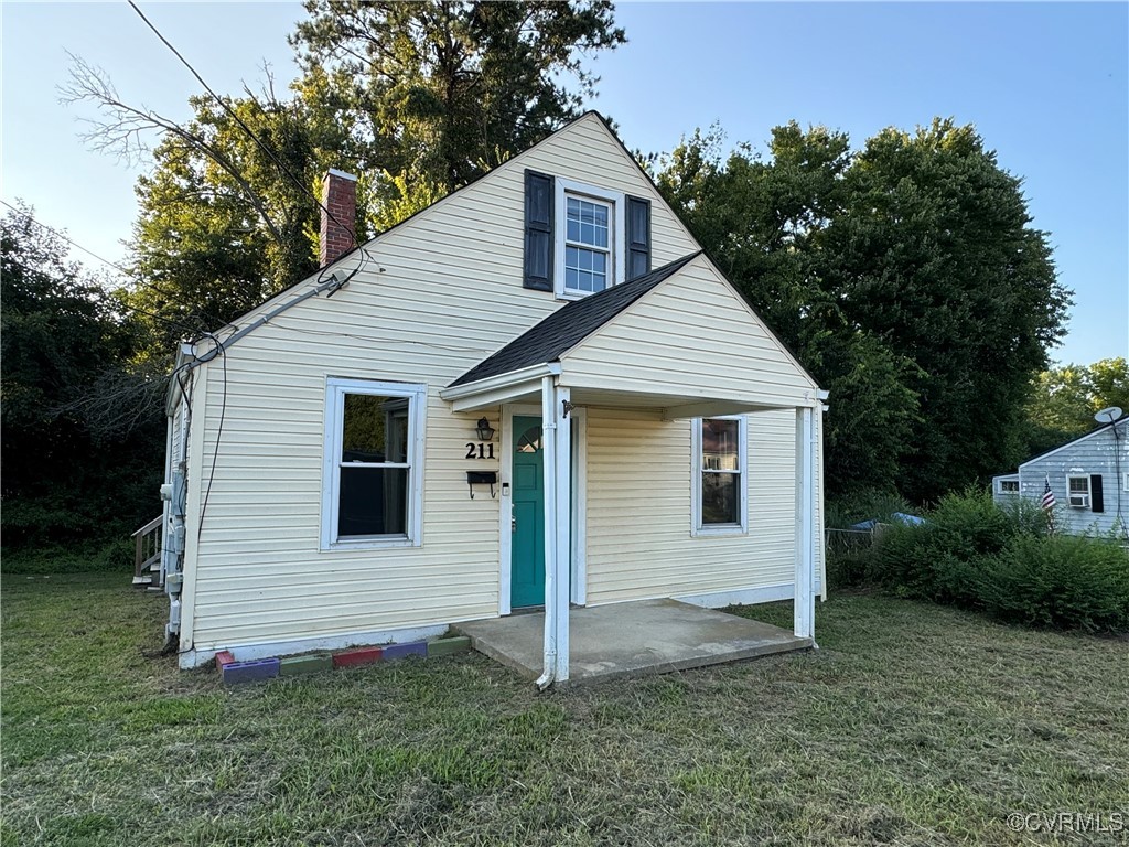 a view of a house with a yard and garage