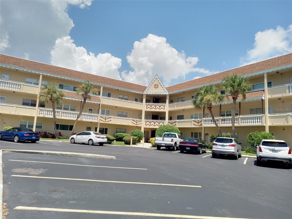 a view of a cars parked in front of a building