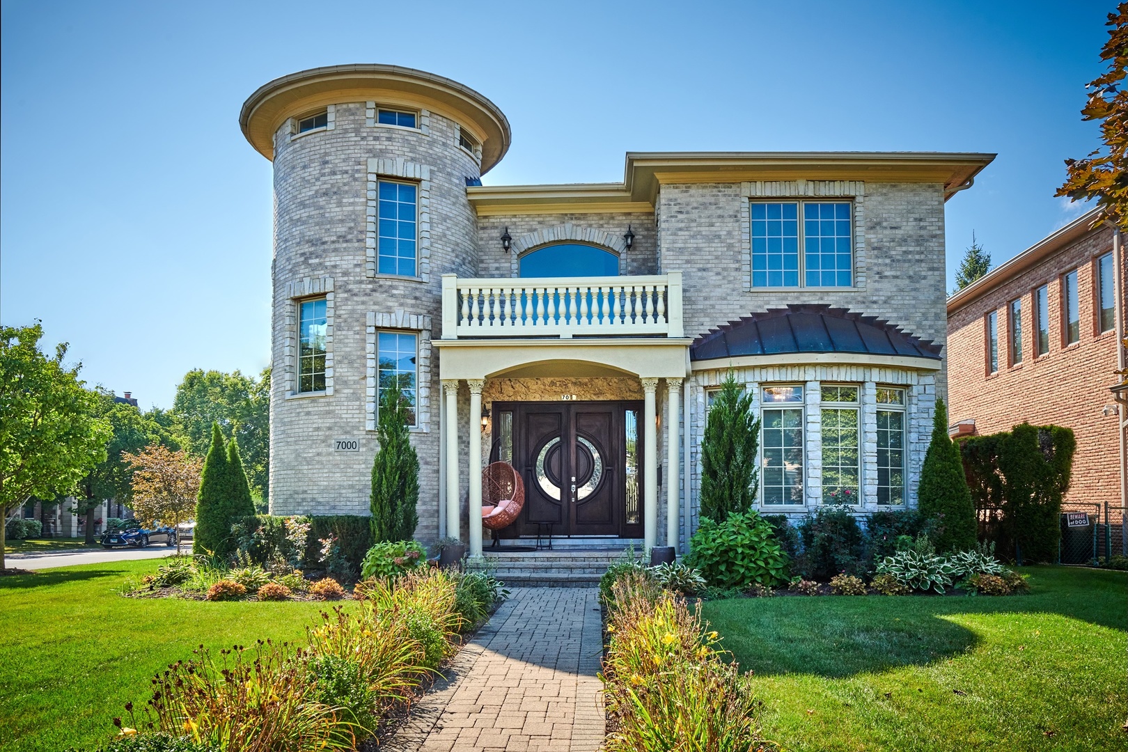 a front view of a house with garden