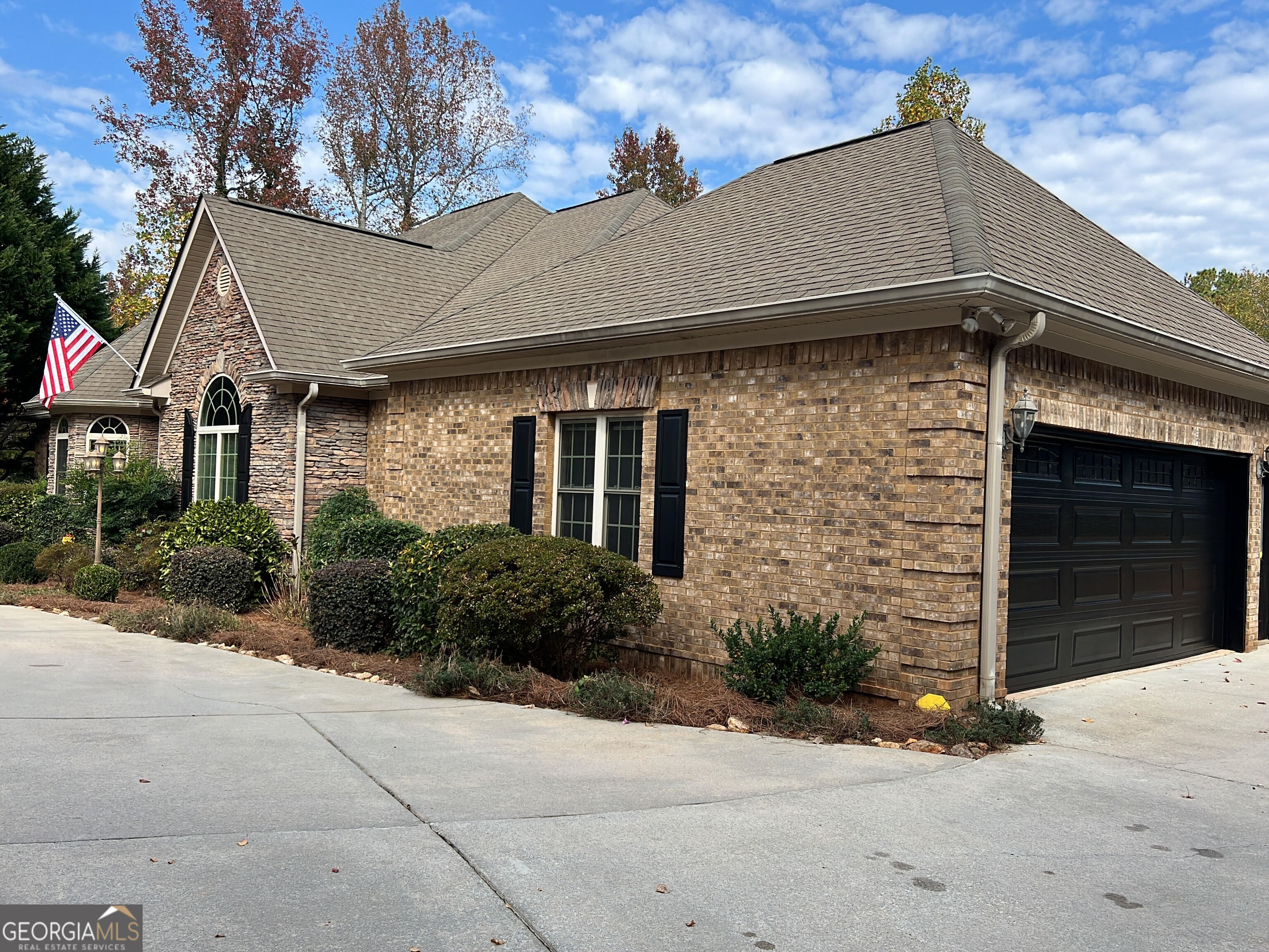 a front view of a house with garden