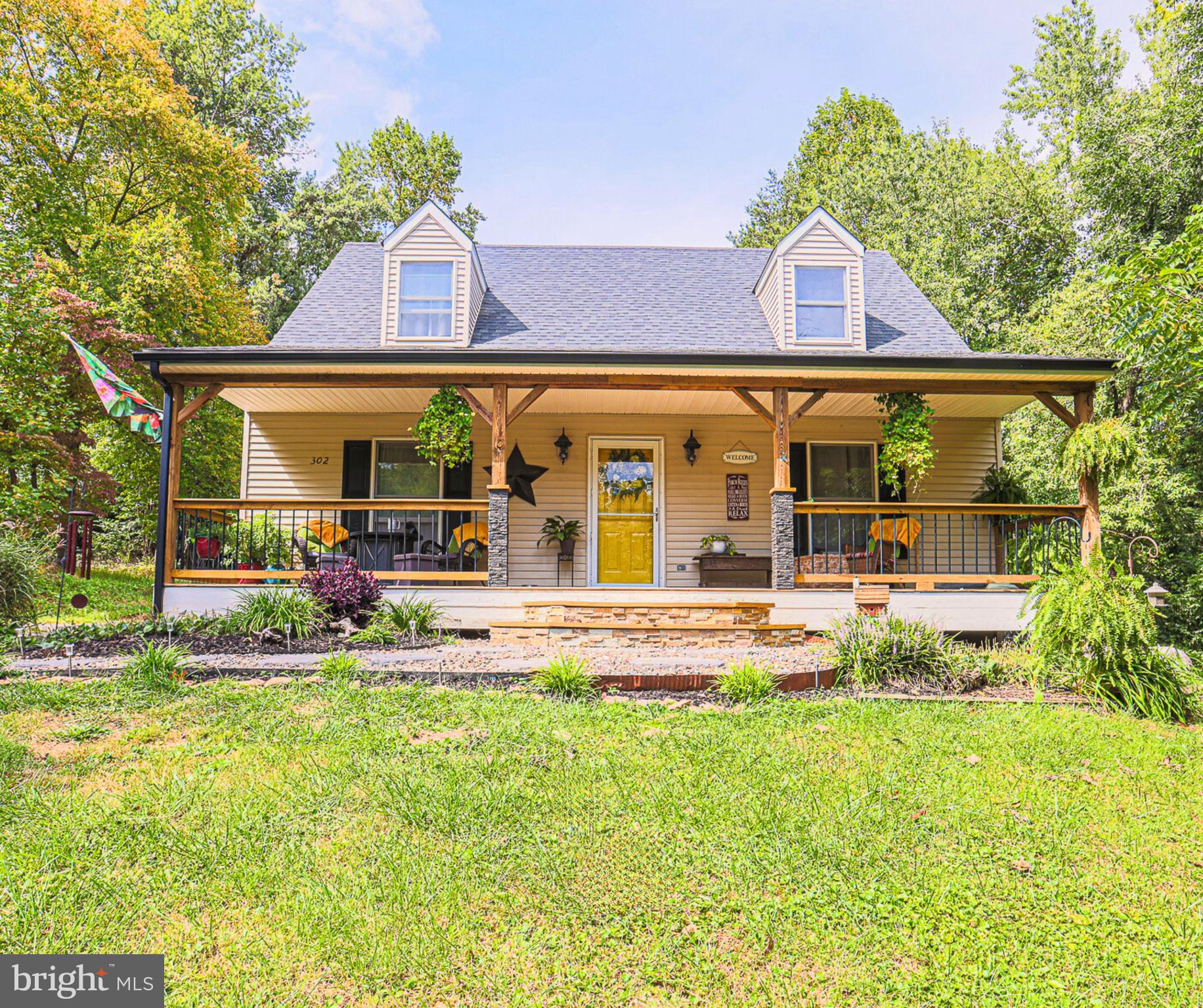 front view of a house with a yard