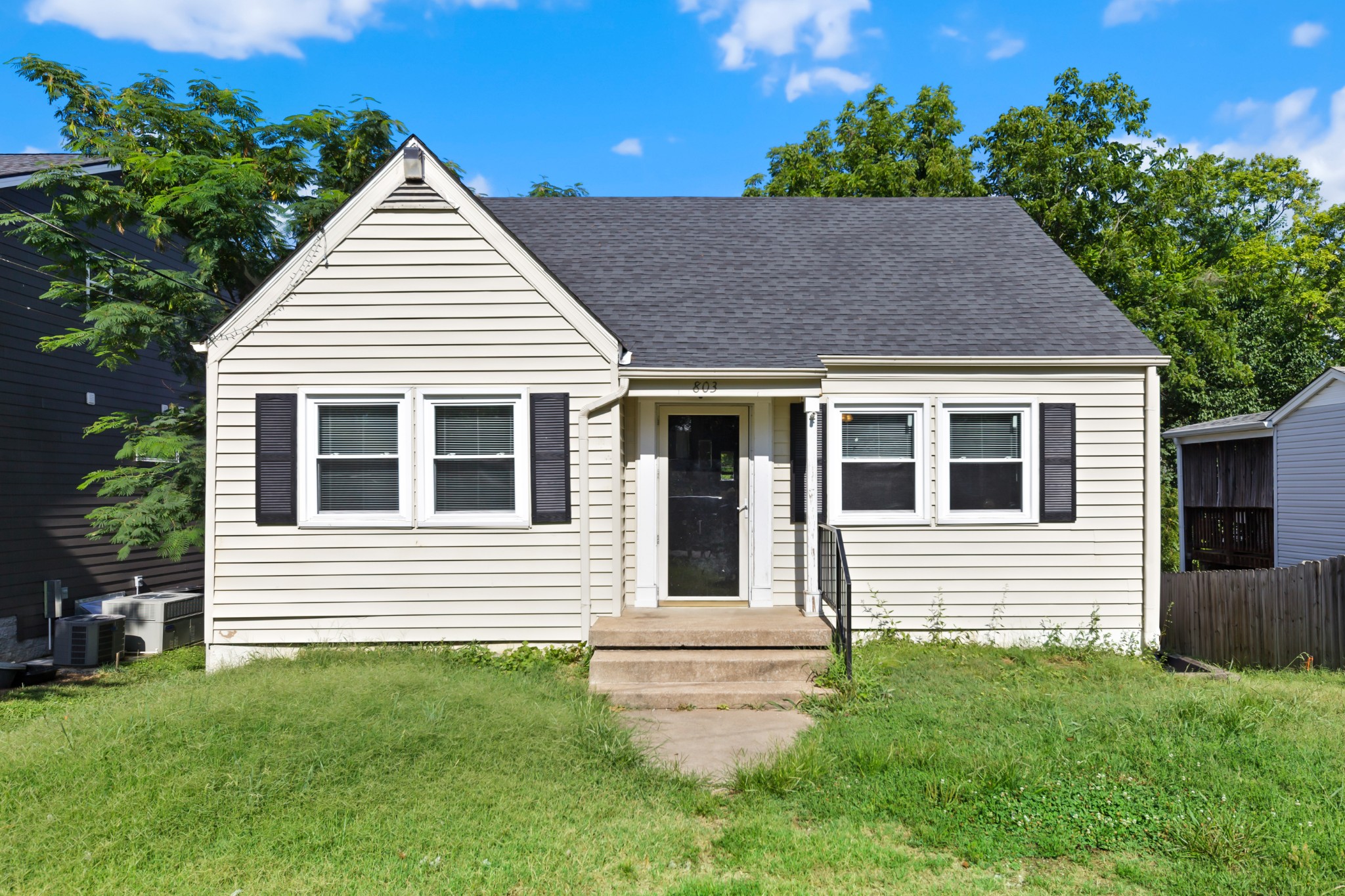 a view of a house with a yard