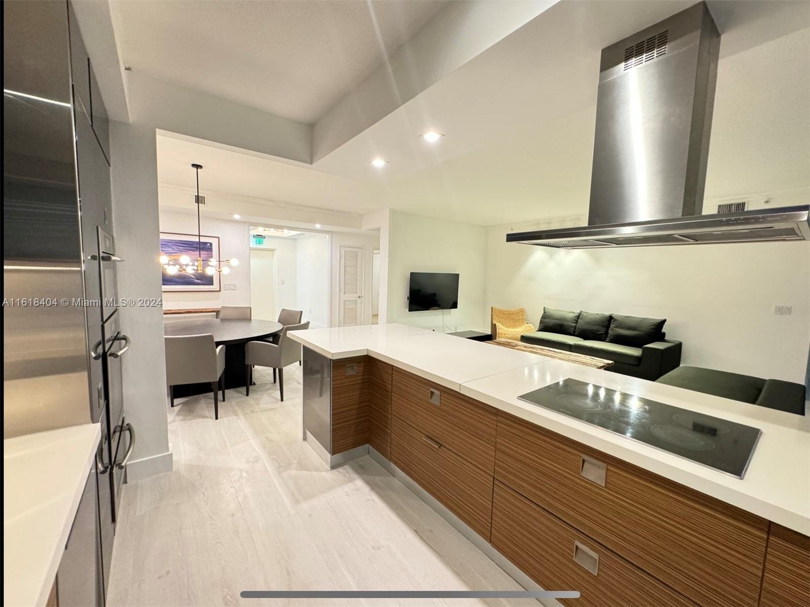 a kitchen with stainless steel appliances a sink and cabinets