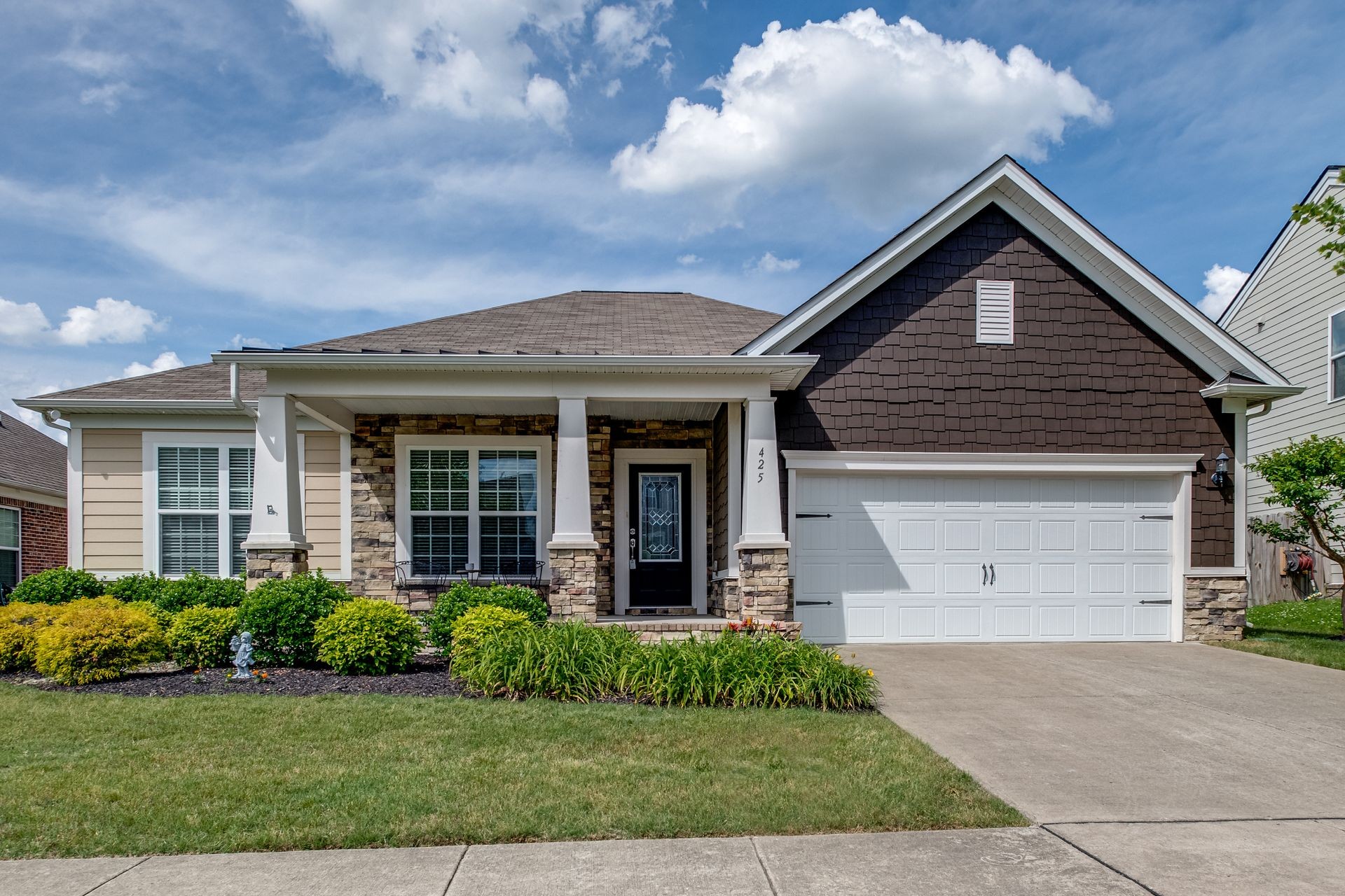 front view of a house with a yard