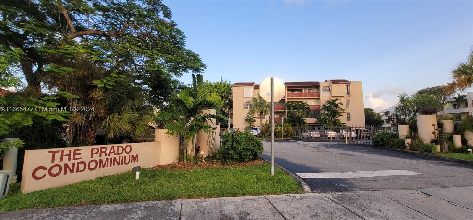 a view of a street with a building in the background