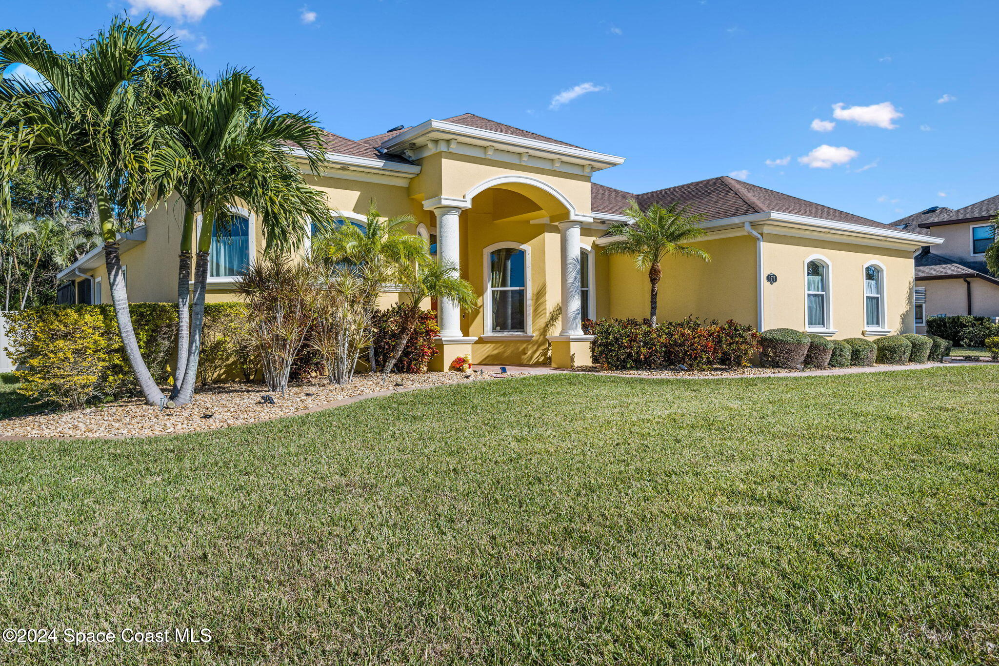 a front view of a house with a yard