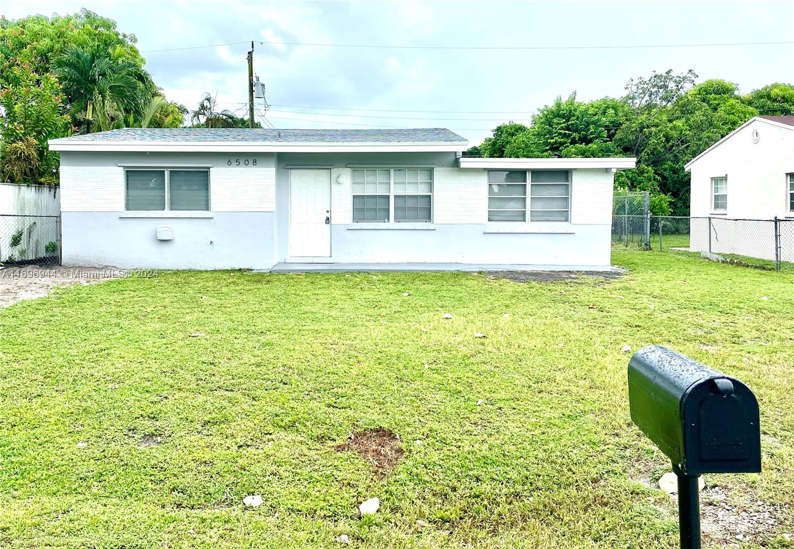 a front view of a house with yard