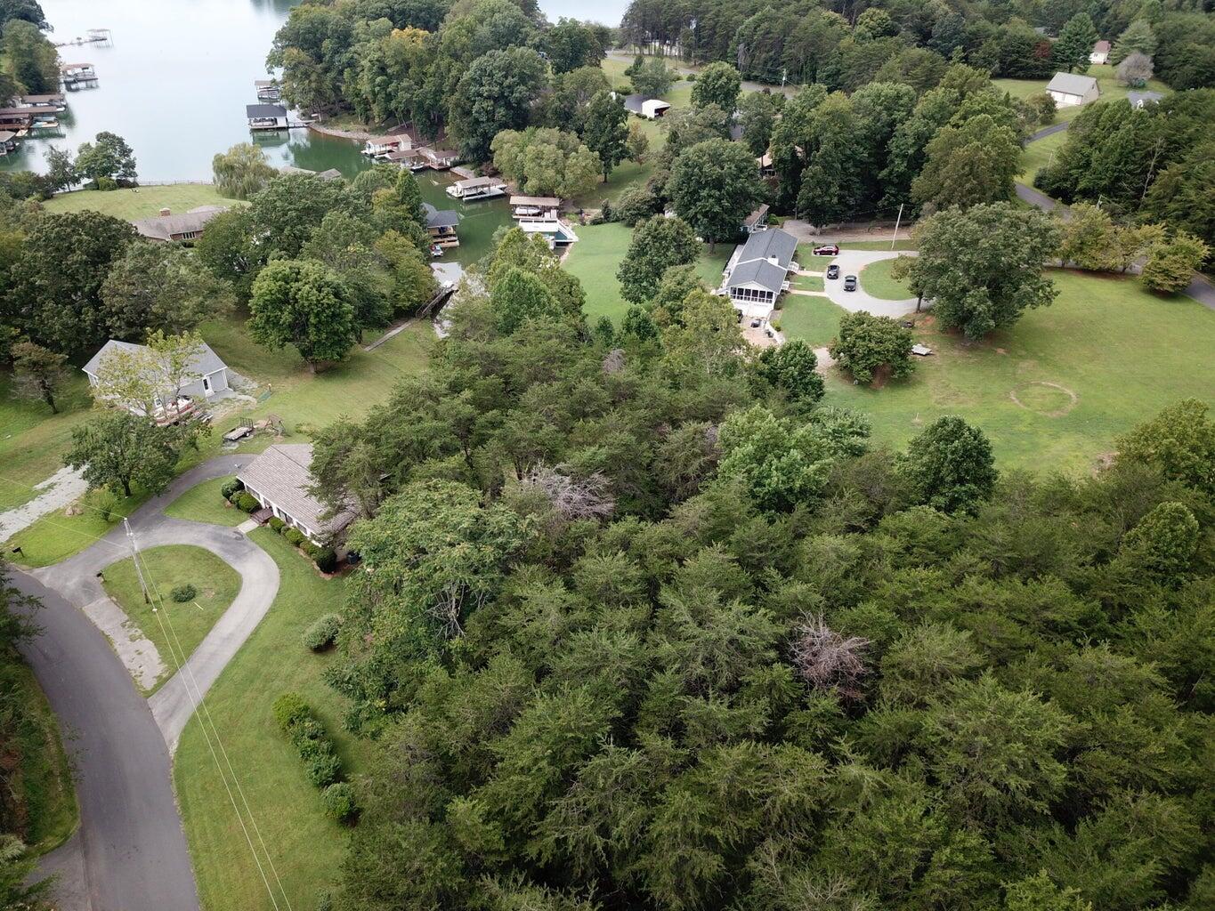 an aerial view of a house with yard swimming pool and outdoor seating