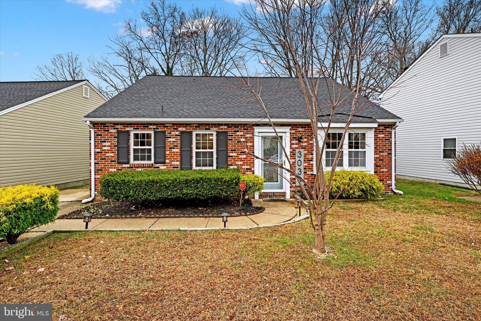 front view of a house with a yard