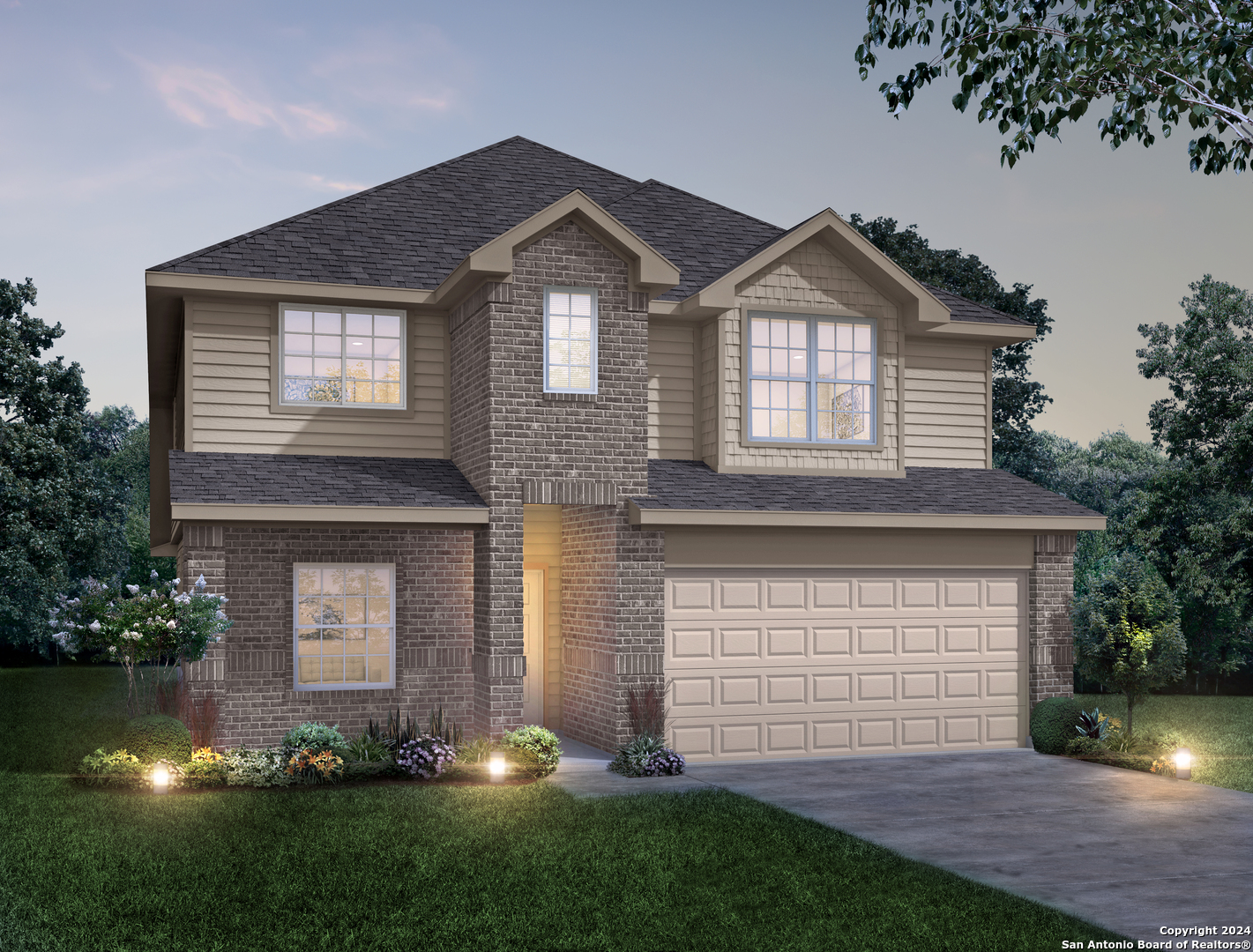 a front view of a house with a yard and garage