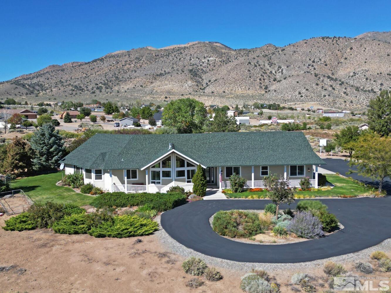 an aerial view of residential houses and outdoor space