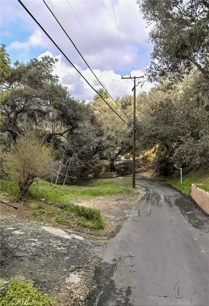 a view of a road with a yard