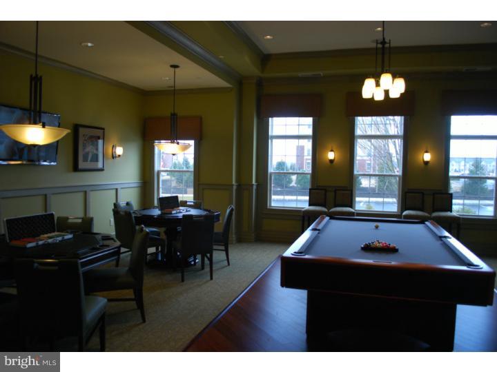 a living room with furniture a dining table and a fireplace