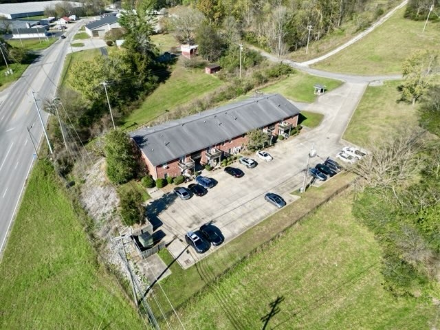 an aerial view of house with a yard