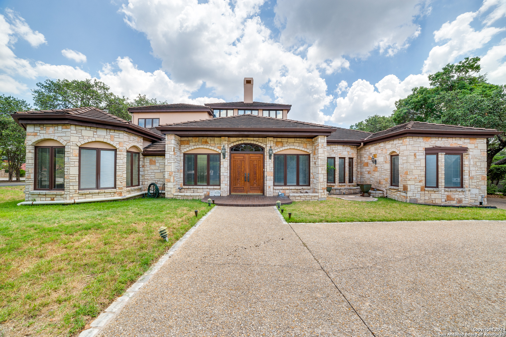 front view of a house with a yard