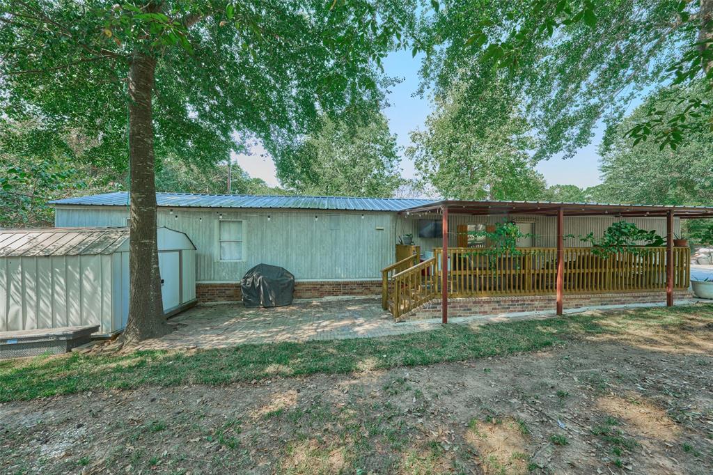 a backyard of a house with barbeque oven