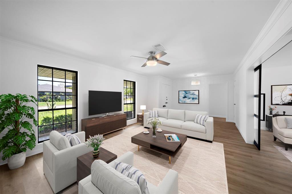 a living room with furniture and a flat screen tv