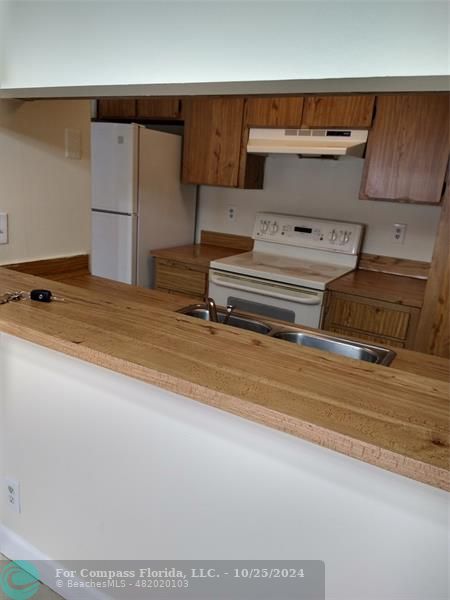 a view of storage and utility room with washer and dryer