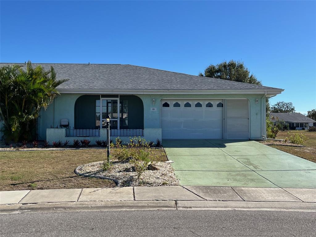 a front view of a house with garage