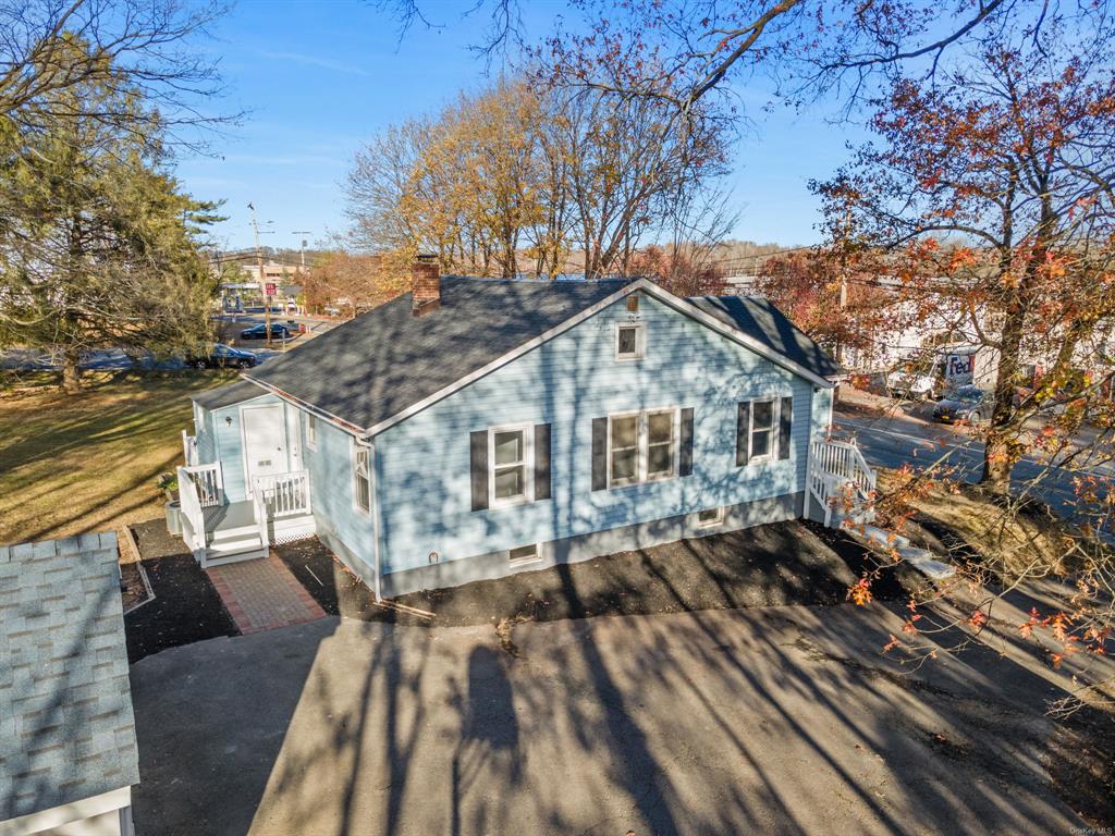 a house with trees in the background