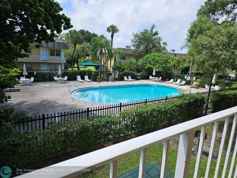 a view of a swimming pool with a patio