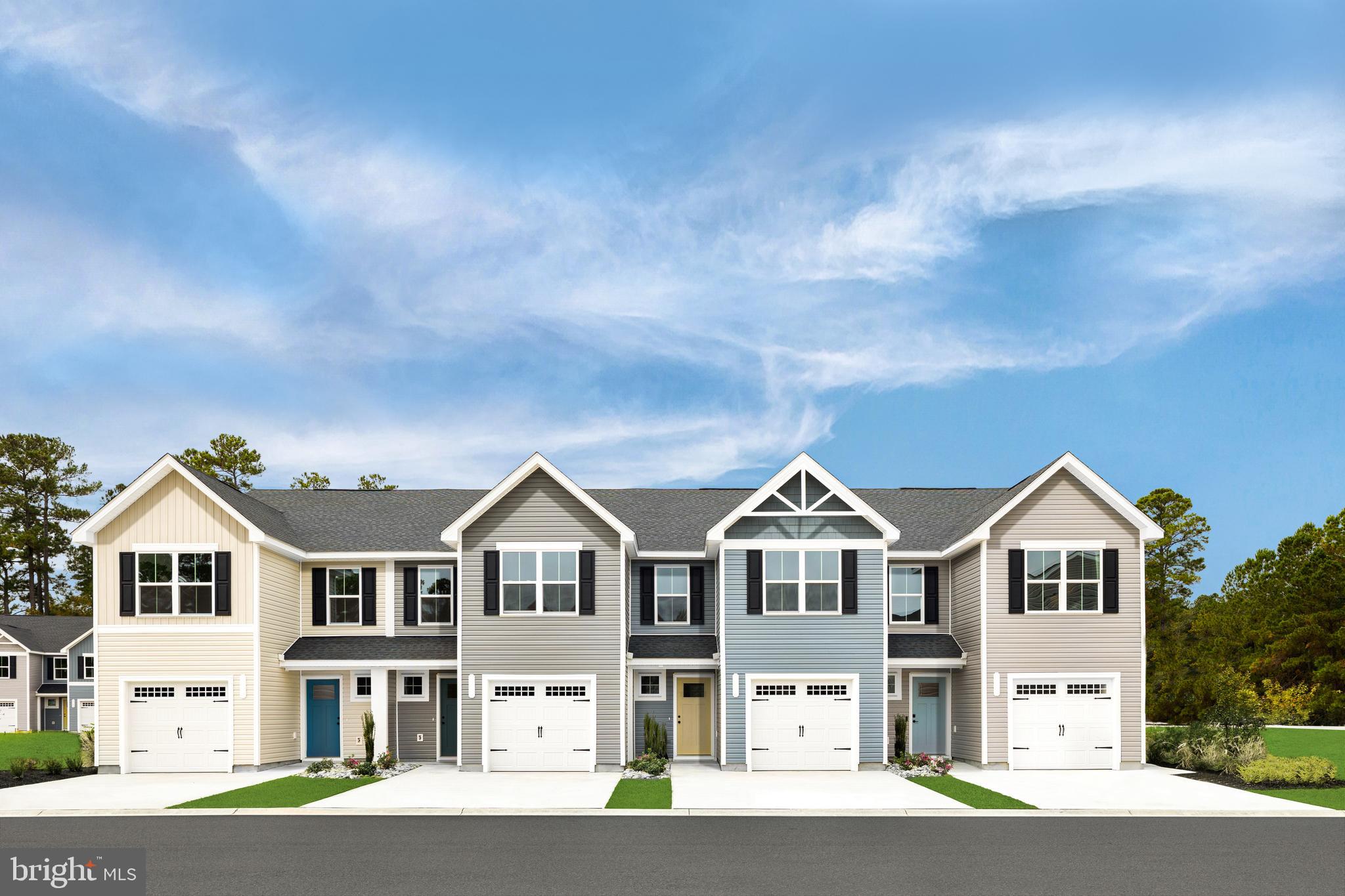 a front view of residential houses with street