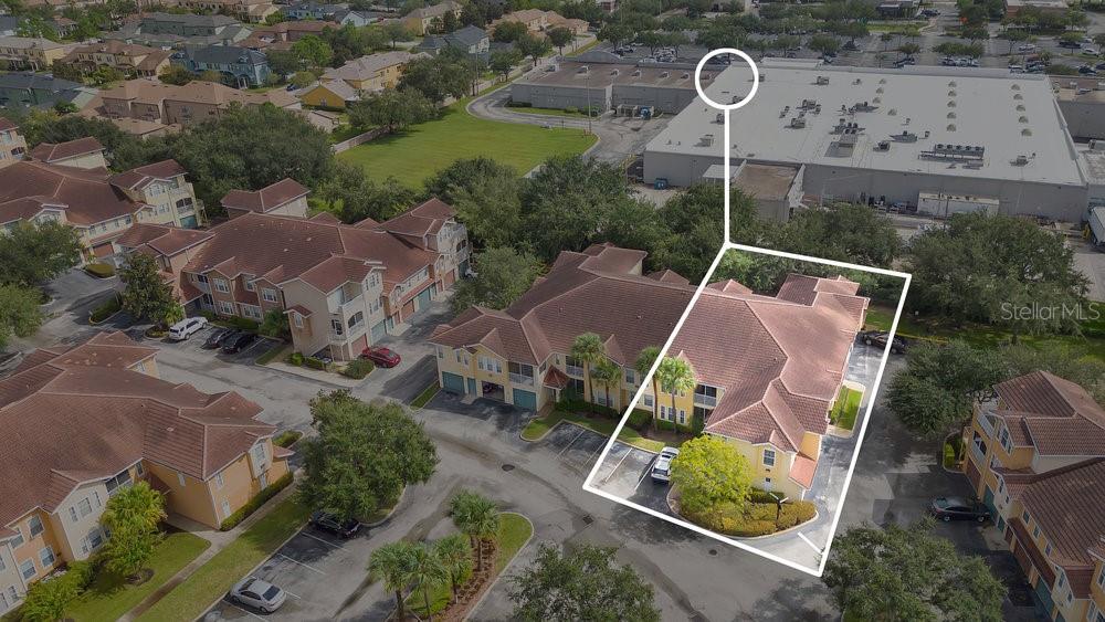 an aerial view of house with outdoor space and swimming pool