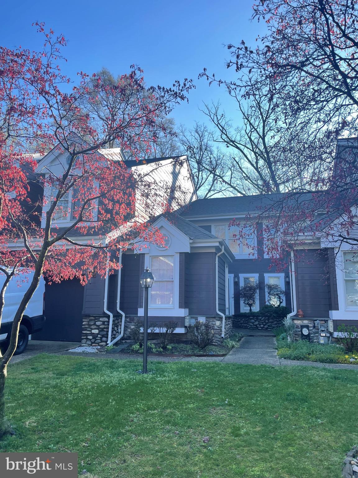 a view of a yard in front of a house