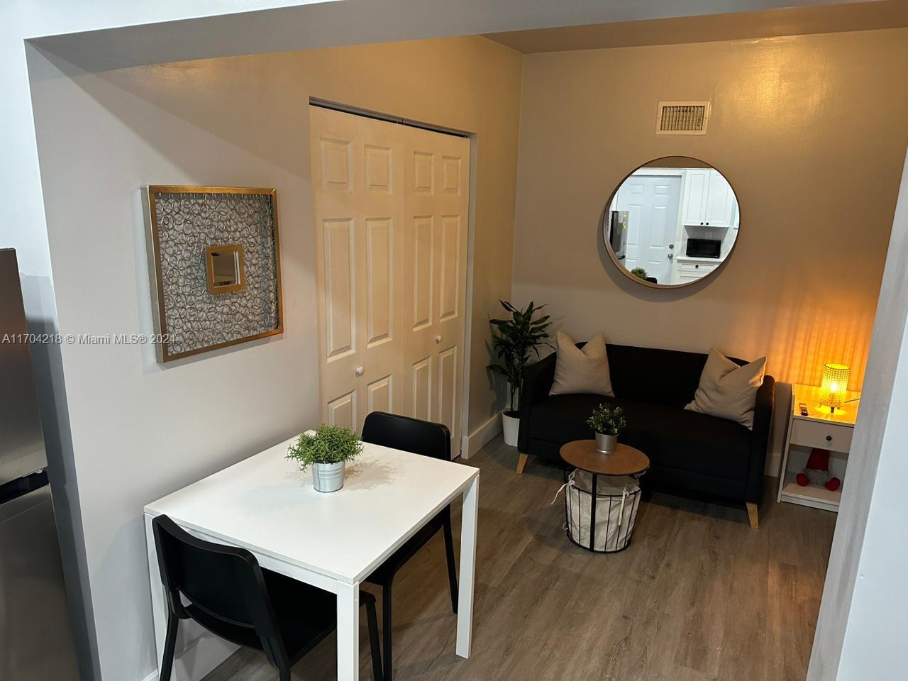 a bathroom with a sink mirror and vanity