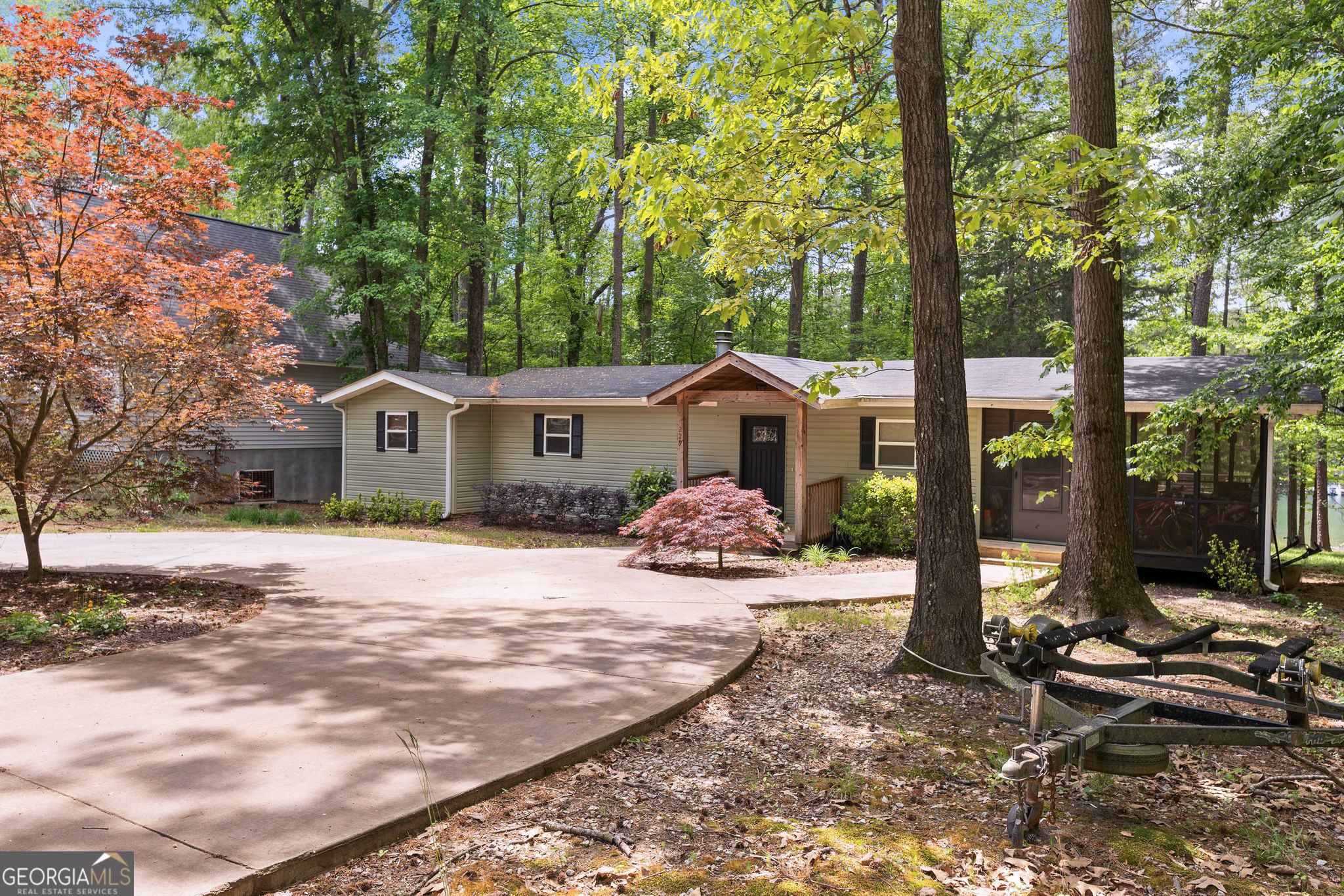 a front view of a house with yard and patio