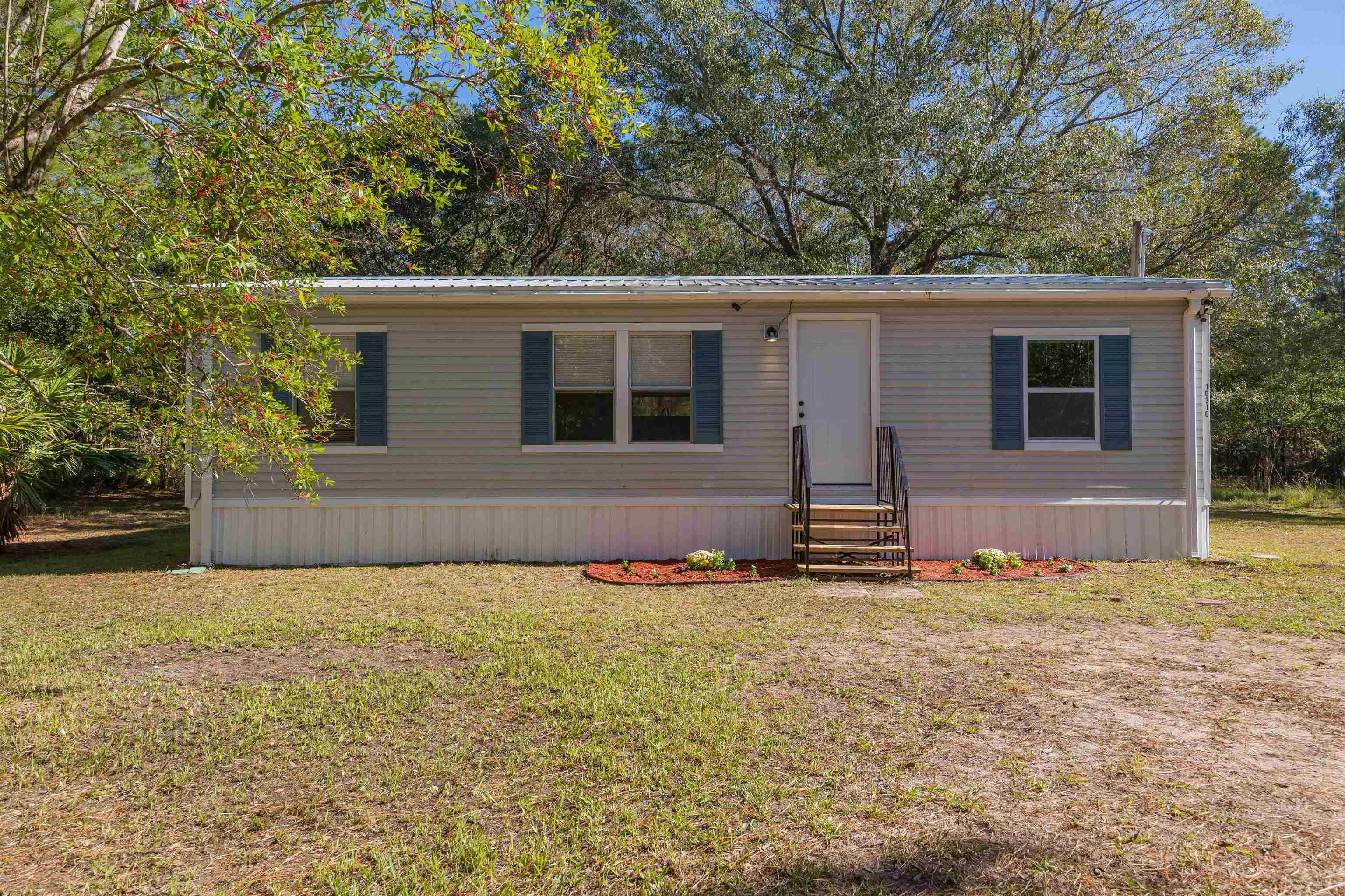 front view of a house with a yard