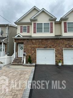 a front view of a house with a garage