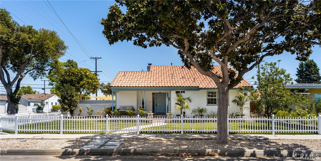 a view of a house with backyard porch and sitting area