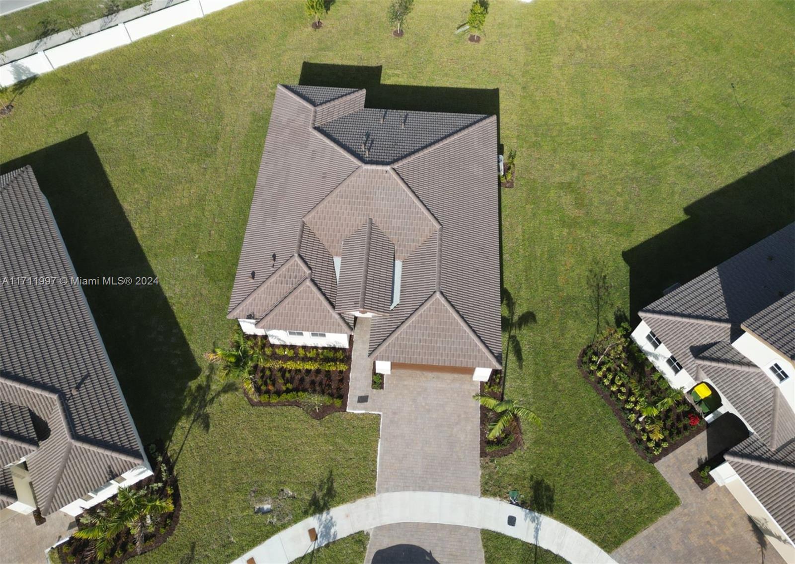 a aerial view of a house with table and chairs