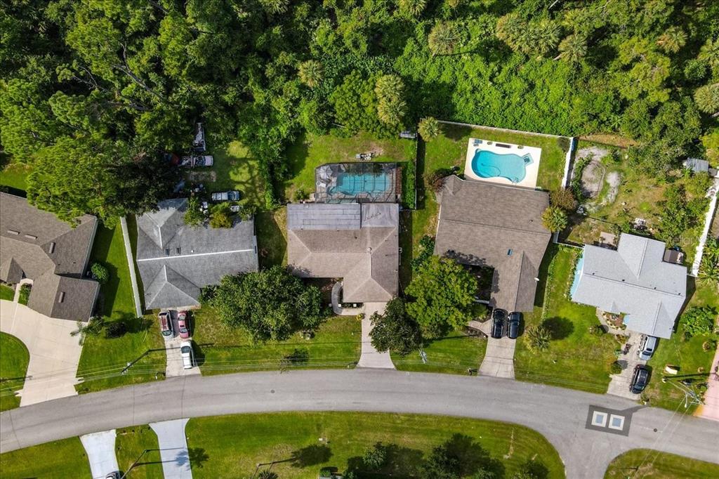 an aerial view of a house with swimming pool