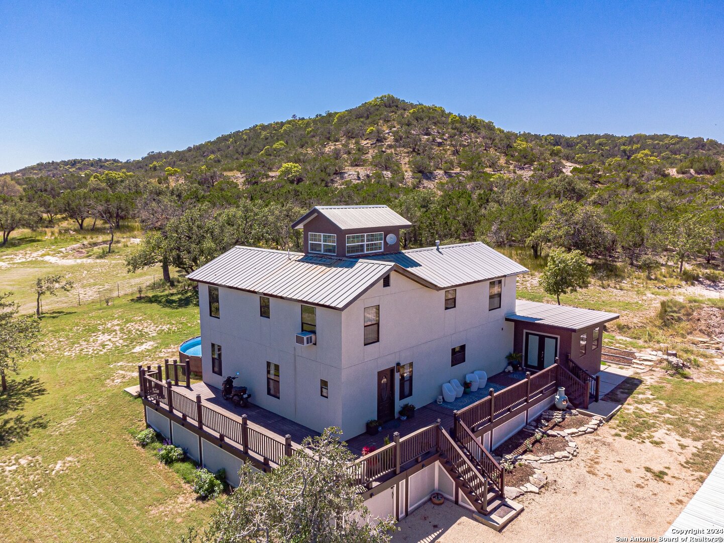 an aerial view of a house with a garden