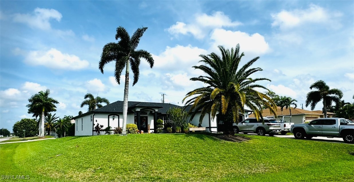 a view of multiple houses with a yard